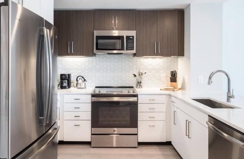 Woodmont Triangle Apartment | Near Chevy Chase | Kitchen w/USB Charging | Take Metro to DC | by GLS