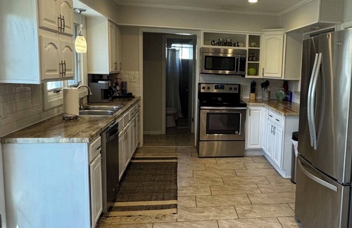 Wichita House | Near WSU: Bumper Pool and Fire Pit! Hosted by Homes by CNJ