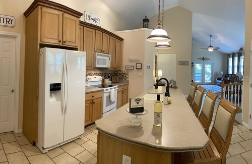 Camdenton House | Nestled by the 7th green, large deck areas. Movie theatre for inside or out.
