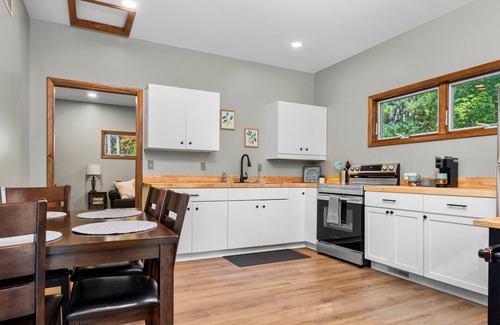 Big Rapids House | Nestled in the woods, this private detached Guest House is a perfect getaway!