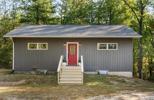 Big Rapids House | Nestled in the woods, this private detached Guest House is a perfect getaway!