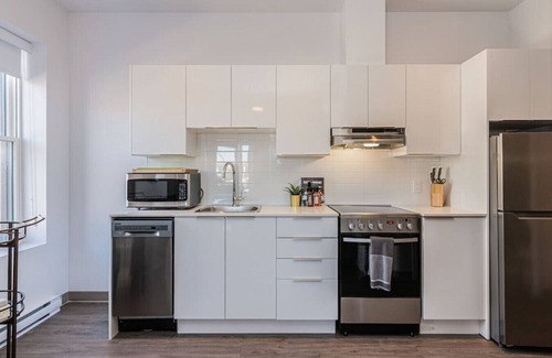 Plateau Mont Royal Apartment | New Flat Located closed on St-Denis Street by Denstays