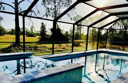Jacarandas House | New heated pool/spa overlooking natural florida preserve.
