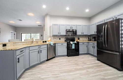 Four Corners Villa | NEW! Modern 4BR South Facing Pool Home Near Disney