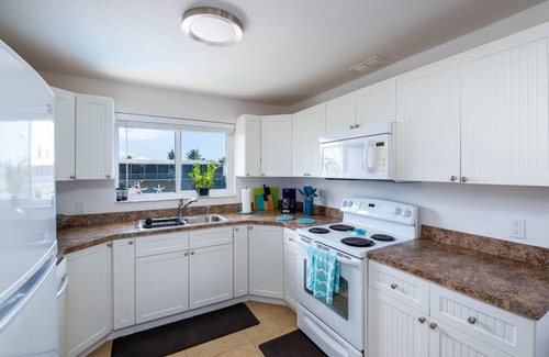 White Marlin Beach House | New saltwater pool, pet friendly, waterfront house with dock