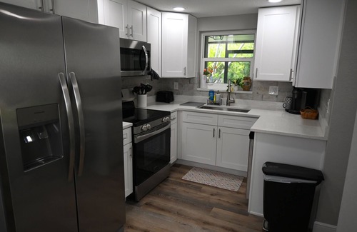 Englewood South House | NEW! Tropical Retreat Cozy Patio ~3 miles to Beach Firepit Wi-Fi A/C