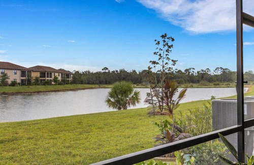 Gran Paradiso House | Newer 2022 Immaculate 4/2.5 Townhome Lake View in Resort Style Community