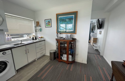 Manly Apartment | Newly finished self-contained unit above Arkles Bay watch sunset over Auckland