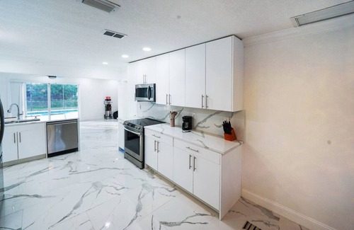 Survey Creek House | Newly Renovated Coconut Creek Home with Pool & Billiards