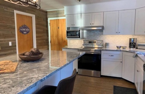 Hamburg Township Cottage | Newly updated waterfront home on chain lakes near Ann Arbor and Pinckney, MI