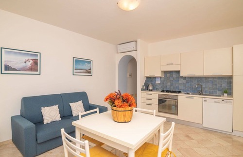 Santa Teresa di Gallura Apartment | Nice apartment for 4 guests with WIFI, A/C, pool, terrace, pets allowed and parking