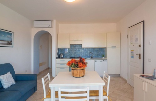 Santa Teresa di Gallura Apartment | Nice apartment for 4 guests with WIFI, A/C, pool, terrace, pets allowed and parking