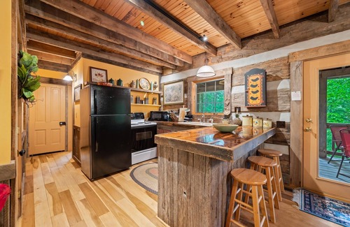 Gnaw Bone Cabin | Nostalgic log cabin antique furnishings nestled in wooded serenity Pet Friendly!