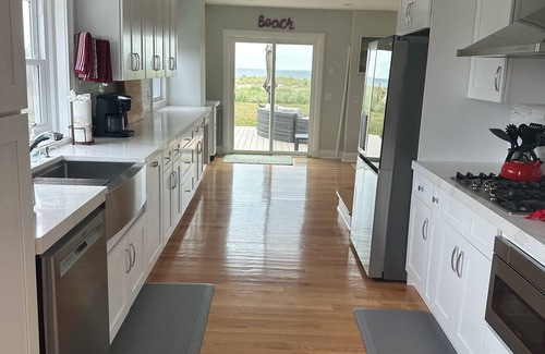 Long Branch House | Ocean Front Beauty with Private Beach, Grass Yard, Beach Volleyball and. More!