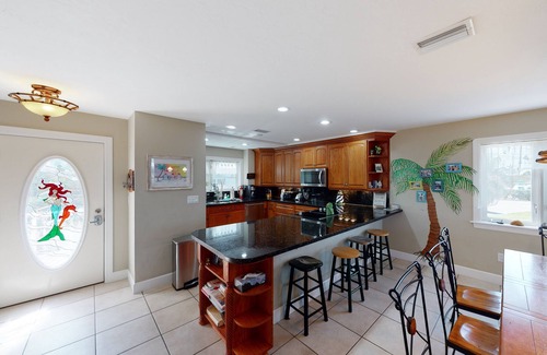 Cutthroat Harbor Estates House | Ocean-view snowbird retreat with private pool, rooftop, lanais, kayak & bikes
