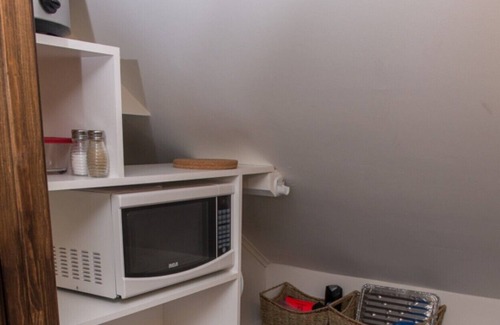 Jonquiere House | One bedroom apartment with balcony