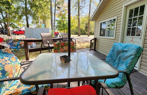 Monticello Cabin | One Bedroom Cabin - Lakeview - Charming 500 sq ft one-bedroom cabin located at Outrigger Resort, just 1/4 mile from Indiana Beach Amustment Park! Features a lake view, private bathroom, kitchen, and living room. One (1) queen bed and one (1) futon al