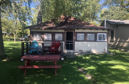 Traverse City House | One-bedroom cabin on Lake Leelanau. Sunset view. Pet considered.