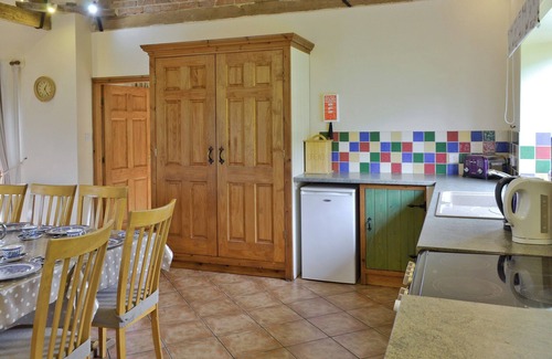 Denstone Cottage | One of two barn conversions with exposed beams and trusses.