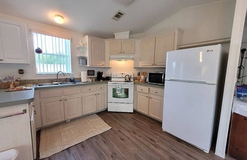 Sebastian House | Open and inviting home with screened in porch.
