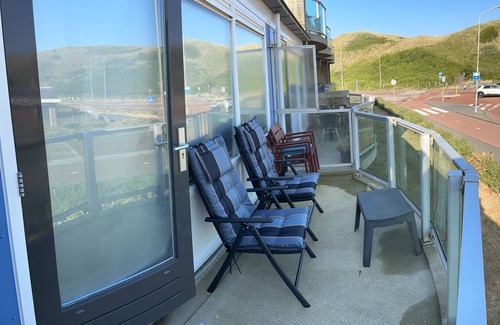 Callantsoog Apartment | Opposite the entrance to the beach, internet, private parking.Energy Label D