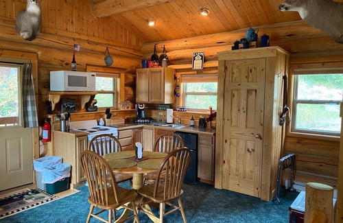 Red Lodge House | Our cozy, secluded cabin is nestled in Haywood Gulch with spectacular views of the Beartooth Mountains. Open layout cabin with full kitchen with dining table and chairs. Comfortable plush queen log bed. Futon couch T.V. Great deck with seating areas,