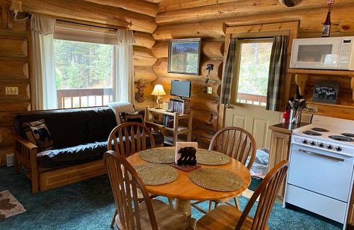 Red Lodge House | Our cozy, secluded cabin is nestled in Haywood Gulch with spectacular views of the Beartooth Mountains. Open layout cabin with full kitchen with dining table and chairs. Comfortable plush queen log bed. Futon couch T.V. Great deck with seating areas,