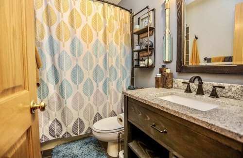 Aberdeen House | OurCozyOasis, Relax in the warmth of the fireplace in this homey upstairs.