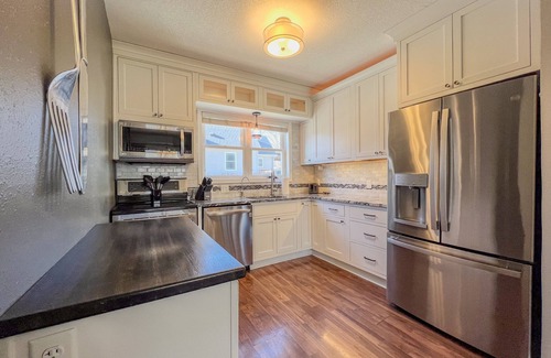 Cedar Falls House | Outdoor Oasis With HOT TUB, Brick Patios, Large Deck & Fenced In - 3Bed/2Bath!