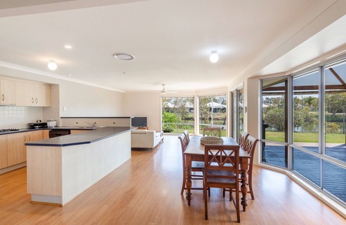 Yamba Apartment | Oyster Cove Sunsets-Nestled along a tranquil canal.