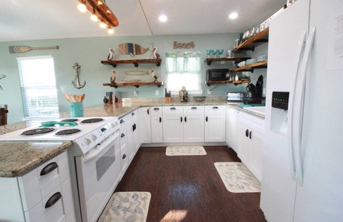 Jamaica Beach House | Palm Breeze Canal Home with Kayaks & Bicycles - Sleeps 6 STR25-000199