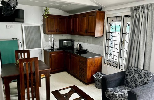 Kochchikade Apartment | Palmwood Cottages Double Bed Room with Kitchen