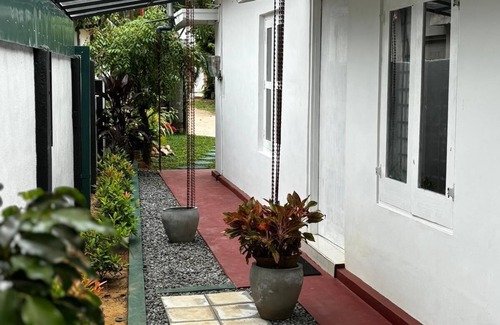 Kochchikade Apartment | Palmwood Cottages Double Bed Room with Kitchen