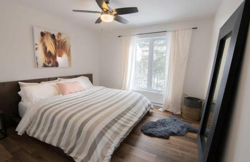 Chertsey House | Panoramic Lakefront Chalet with Hot Tub & Firepit