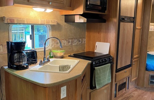 Britt House | Perfect spot for your next stay: RV camper on quiet, wooded lake lot