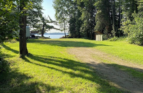 Britt House | Perfect spot for your next stay: RV camper on quiet, wooded lake lot