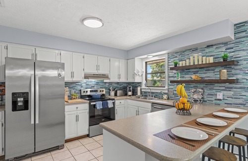 Thomas Drive House | Pet-friendly 3BR/2BA Panama City Beach vacation home near Pier Park, St. Andrews State Park, and white-sand Gulf beaches. Enjoy a fenced backyard, full kitchen, fast WiFi, and cozy spaces—perfect for family beach getaways with your furry friend!