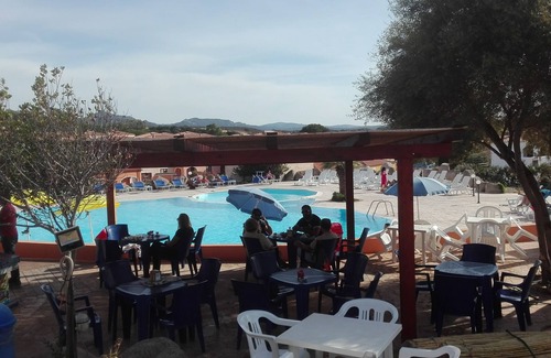 Aglientu Apartment | Pink house in residence with pool, wifi -air conditioner, near the sea