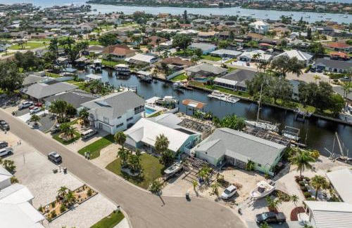 Bal Harbour House | Pirates Den a 4BR Pet-Friendly Waterfront Oasis with Pool, Dock, Personal Water Boats, Fire Pit, Game Room and Bar