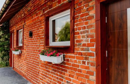 Poniatowa House | Pod ceglaną ścianą