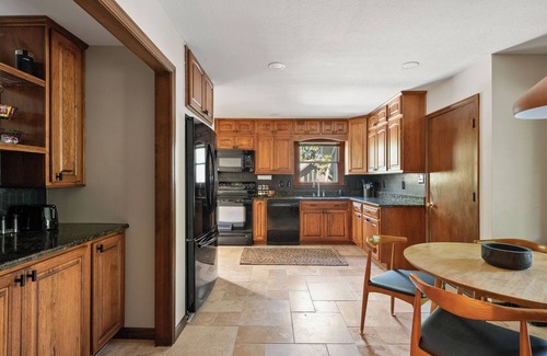 Merriam House | Pool & Hot Tub in the heart of KC! Tons of stylish space inside and out!