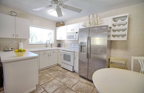 St. Pete Beach Condo | Pool view. Upstairs unit & workspace