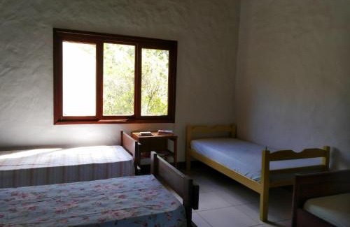 Passa Vinte House | Pousada Caminho dos Ipês