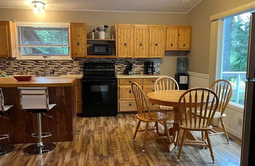 Candle Lake House | Privacy Galore! Enjoy this roomy year round lake home surrounded by the forest
