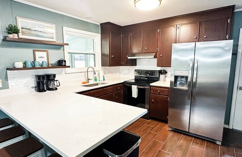 Pensacola House | Private 4-bed/3 bath house with putt-putt golf, heated pool, and hot tub.
