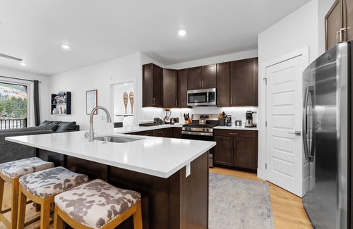 Lakeside Village Condo | Private Balcony with Cozy Outdoor Seating & Mountain Views! 2 Shared Hot Tubs