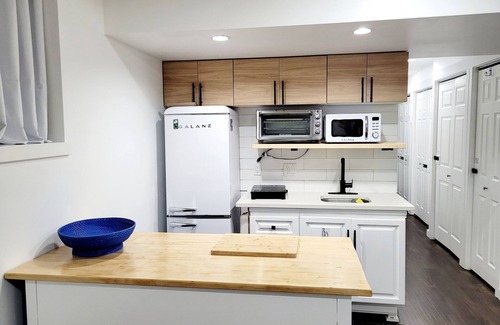 Surrey House | Private Bright Basement Suite