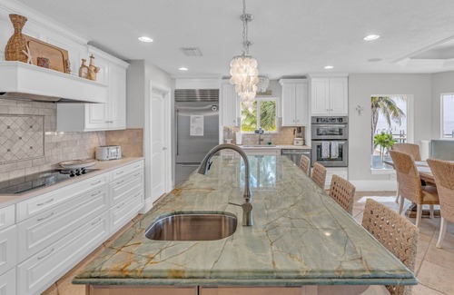 Marathon House | Private, Gated, Oceanfront, Beachfront 5-Star Estate with dock, putting green.