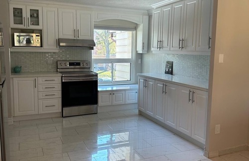 Mississauga Valleys House | Private home with large bedroom and spacious common areas with patio.