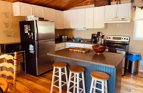 Tudor and Cashel Cabin | Private Lakefront 3 Bedroom Cabin with Private Dock and Boat Port. Boat Access